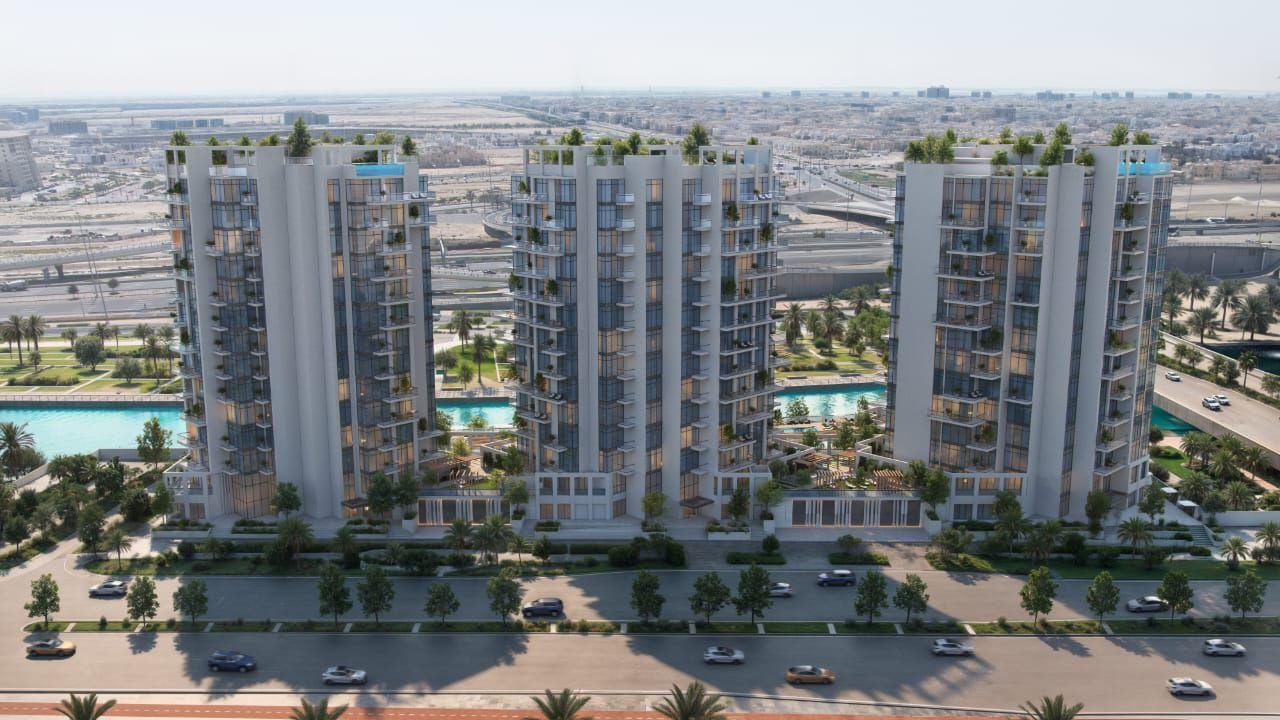Aerial view of Canal View Residence showing three towers, rooftop pools, and landscaped podium levels in Al Raha Beach.